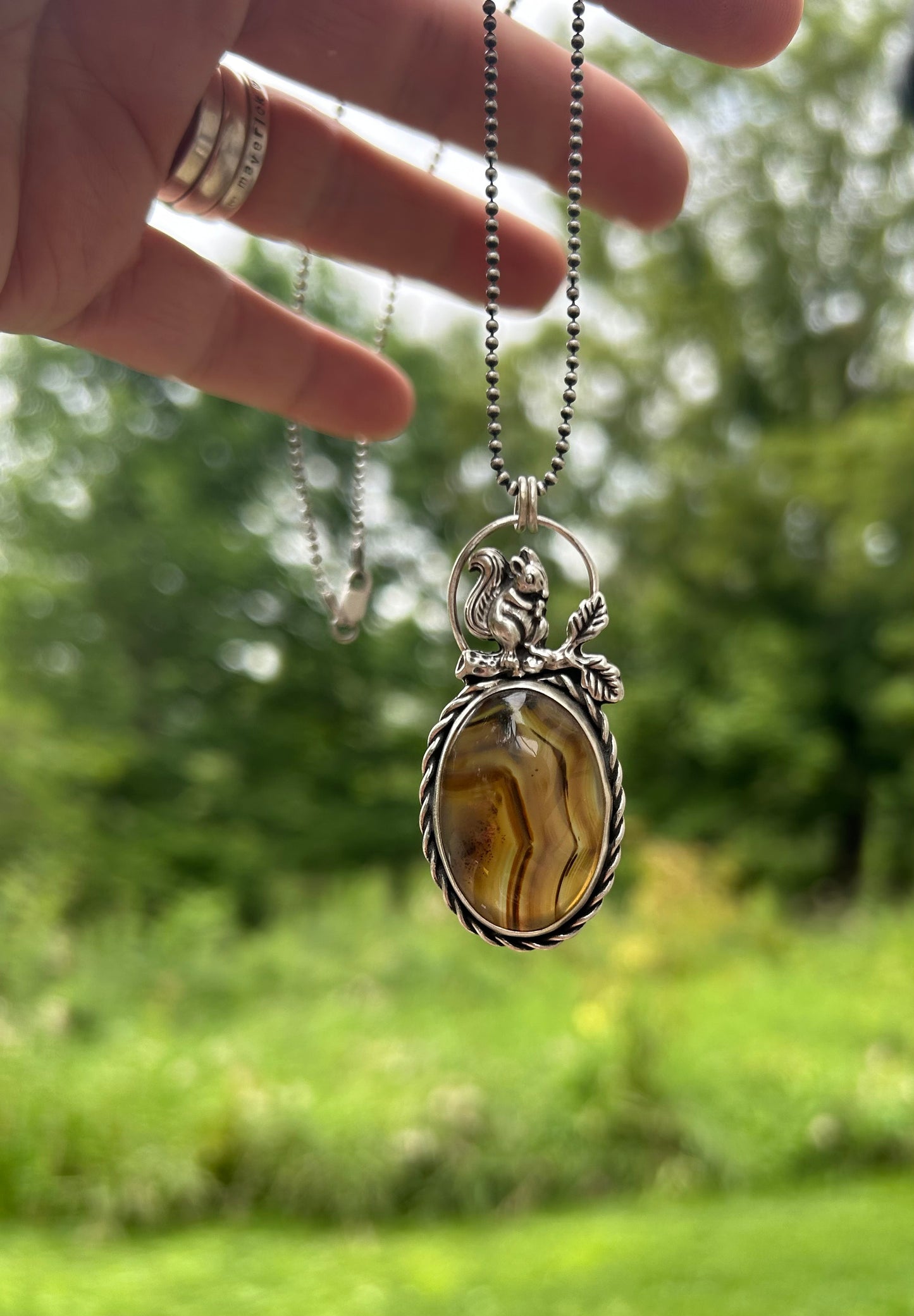 The Bentley Pendant Necklace, Montana Agate with Squirrel.  Solid Sterling Silver, 18” Ball Chain